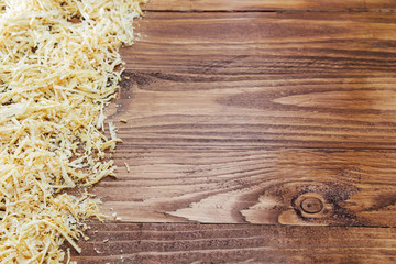 A lot of chips on the background of dark wood.