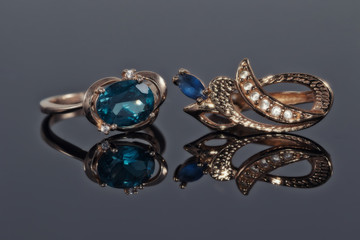 Gold earrings and ring with blue Topaz