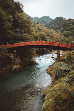Red bridge over river