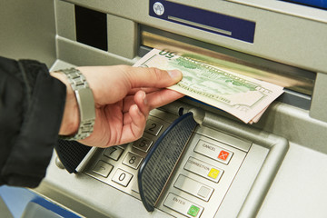 Dollar cash withdrawal from ATM - obrazy, fototapety, plakaty