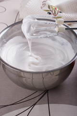Bowl with whipped to solid peaks protein with sugar