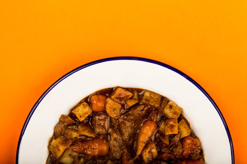 Beef and Red wine Casserole With Roast Potatoes Carrots and Mushrooms