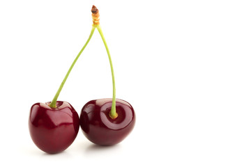 two ripe berries of a red cherry tree
