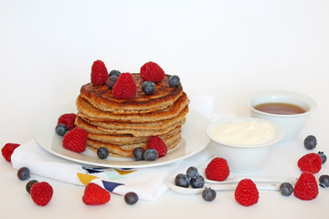 Healthy homemade pancakes with fruit and natural yogurt