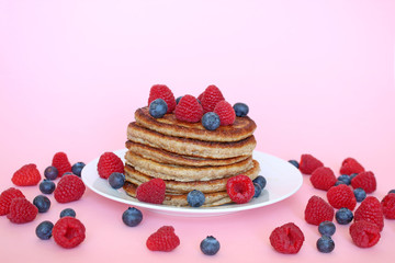 Homemade healthy pancakes with raspberries and blueberries