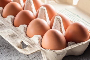 Farm raw fresh egg in pack on gray table scrambled eggs omelet fried egg - 187663161