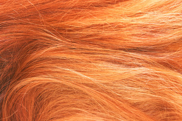 Red woman hair texture. Selective focus. Abstract background.