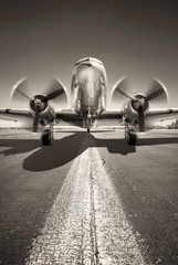 historic aircraft is waiting for take off on a runway - obrazy, fototapety, plakaty
