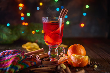 Christmas mulled wine with oranges and spices with bokeh lights