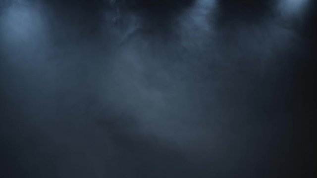 White smoke on black background of a shapeless movement