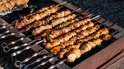 Shish cebab on a spit on a brazier
