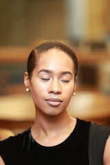 African-American pretty woman with eyes closed