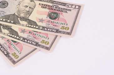 Three 50 dollar banknotes isolated on white background.