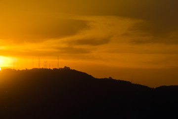 Sunset in Guatemala, mountain silhouette, communication antenna