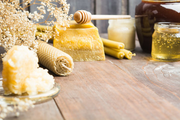 Apicultural products on wooden background with copy space