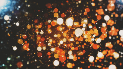 Abstract festive background with blurred bokeh particles