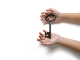 Children's hands hold a key on white isolated background