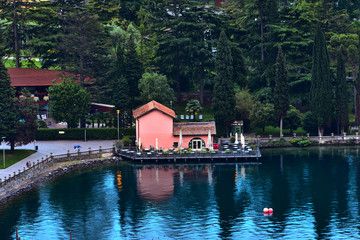 Obraz premium View of the beautiful Lake Garda .Riva del Garda town and Garda lake in the summer time , Italy