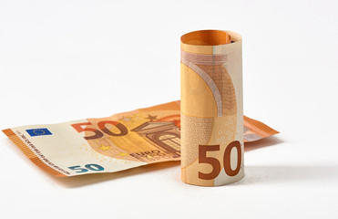 Euro money bank. Rolled up Euro bills on white background. One hundred and 50 Euro bills