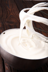 close up of a white whipped or sour cream in bowl