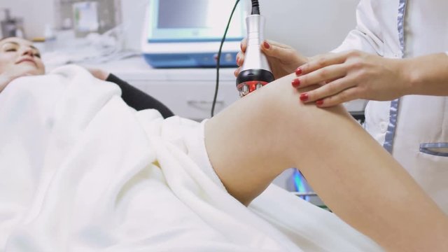 Young woman at the rf-lifting procedure in beauty salon