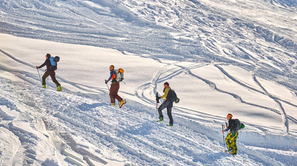MADONNA DI CAMPIGLIO, ITALY-21 November 2014:Skier climb on skis and sealskins. Ski resort Madonna di Campiglio Italian Alps in sunny day