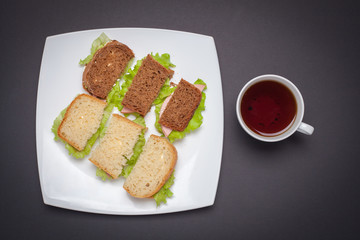 Lay the bruschetta on a white plate.