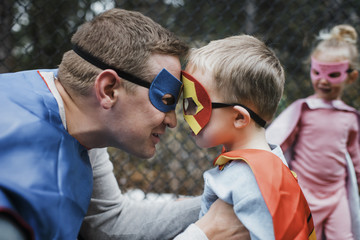 Close up of family dressed in superhero costume
