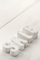 beton letters on a wooden board