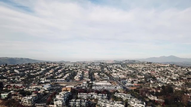 Beautiful 4k aerial drone bird eye panorama view on small commuter town house city neighborhood in cloudy sky cityscape