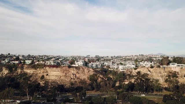 Incredible 4k aerial drone bird eye panorama view on small commuter town house city neighborhood in cloudy sky cityscape