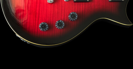 A black and red guitar sunburst colored guitar.