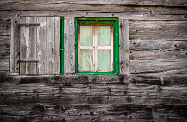 Naklejka na ściany i meble Wooden wall with green window