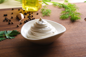 mayonnaise sauce on a wooden background cooking