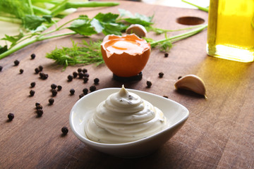 mayonnaise sauce on a wooden background cooking