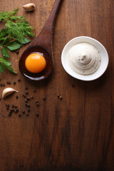 Obraz na płótnie Canvas mayonnaise sauce on a wooden background cooking