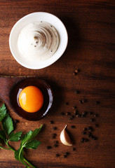 mayonnaise sauce on a wooden background cooking