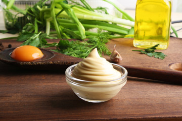 mayonnaise sauce on a wooden background cooking