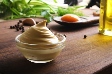 mayonnaise sauce on a wooden background cooking