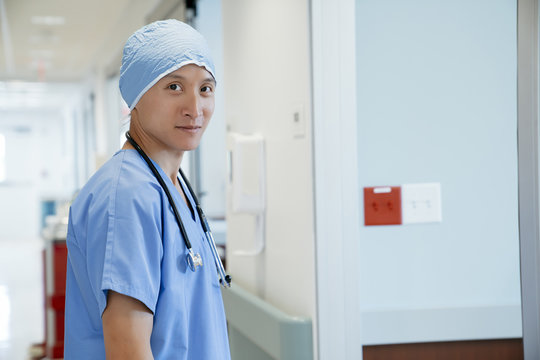 Portrait Of Surgeon Standing In Hospital Corridor