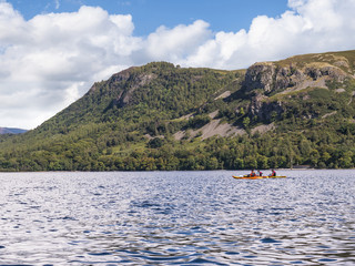 Fototapeta na wymiar Enjoy a lake cruise on one of the Keswick Launches and experience the beauty of Derwentwater with breathtaking views of the surrounding fells. 