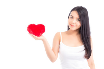 Portrait of asian young woman holding heart shape pillowand smile, valentines day, holiday concept.