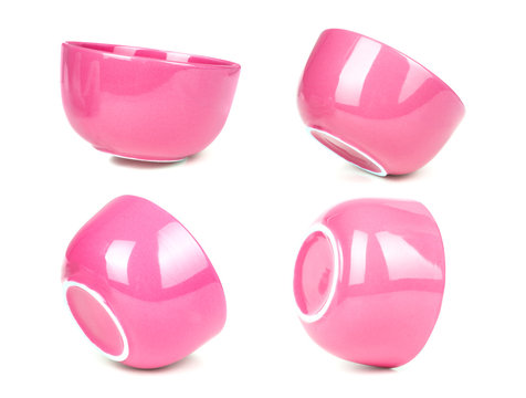 Set of pink bowls isolated on background of fake