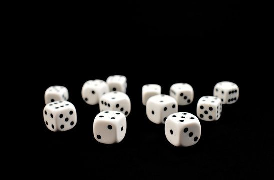 Dice stock images. White dice on a black background