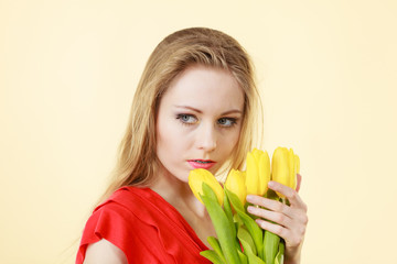 Young woman holding tulip bouquet