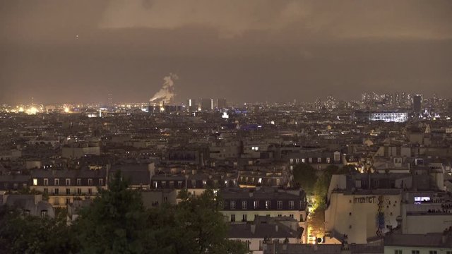 PARIS, FRANCE  – SEPTEMBER 2016 : Video shot over central Paris cityscape with skyline and factory smoke in view