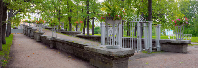 A gently-sloping ramp to the park from the Hanging Garden decorated with vases by cast-iron...