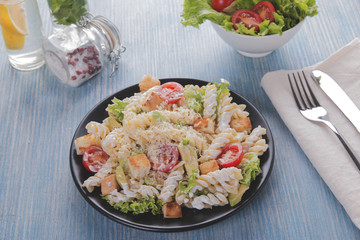 caesar salad pasta avocado chicken fillet tomato sauce close up