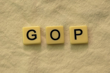 The abbreviation 'GOP' spelled out in letter tiles on a textured background
