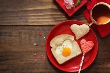 Valentines day breakfast fried  heart shaped egg bread toast coffee